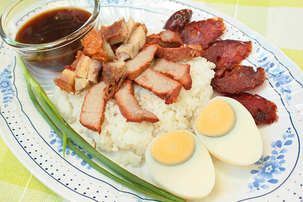 istock BBQ Pork, sausage, crispy pork over rice. 505920679