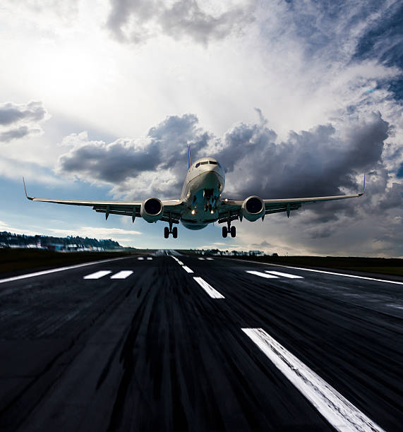 istock Passenger airplane landing at dusk 505920748