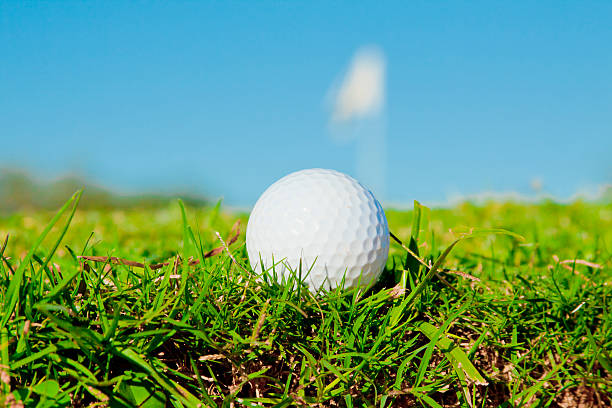 istock golfball on edge of  bunker with green infront 505921752