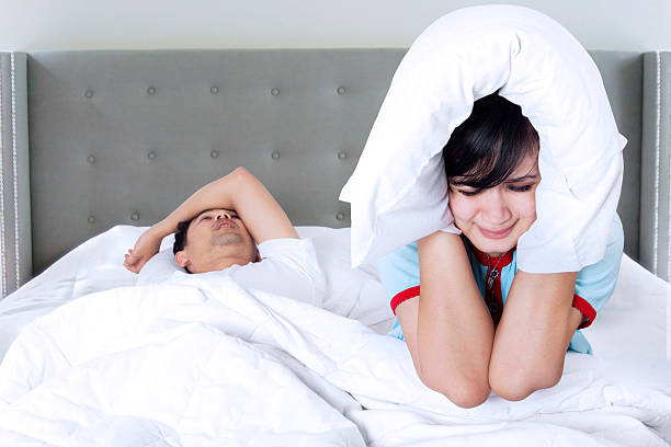 istock Snoring man and unhappy woman 505921918