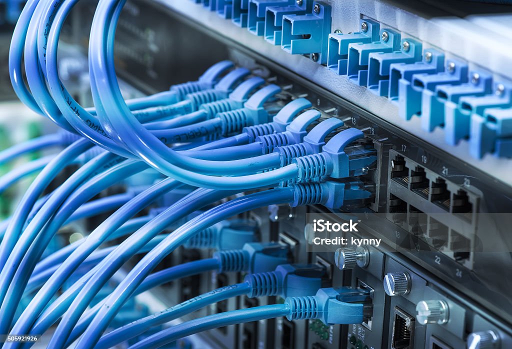network cables connected to switch patch network cables connected to switch Network Server Stock Photo