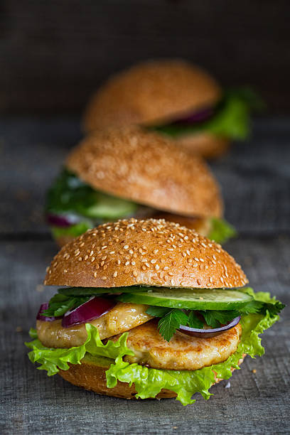 istock Three homemade hamburgers with fresh vegetables 505922080