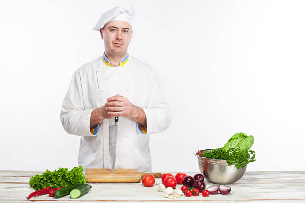 istock Chef posing with knife in his kitchen 505922118