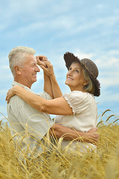 istock Senior couple resting at  summer field 505922786