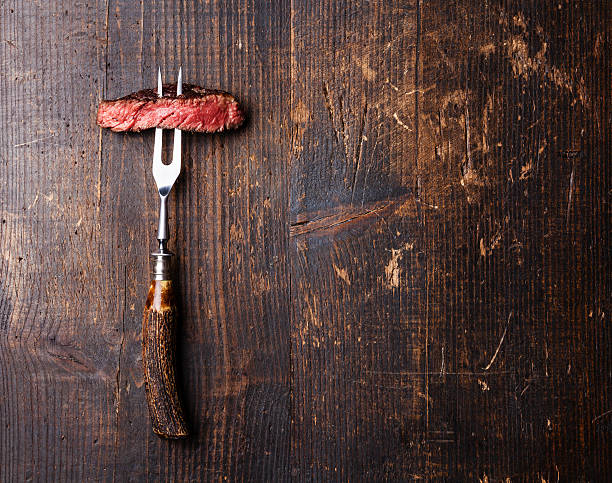 istock Slices of Steak Ribeye on meat fork 505923768
