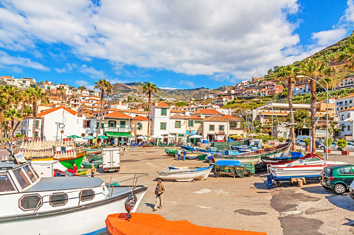 Camara de Lobos, Madeira, Portugal - June 8, 2013: Port with fishing boats. The village is typical for its cat shark drying under the sun.