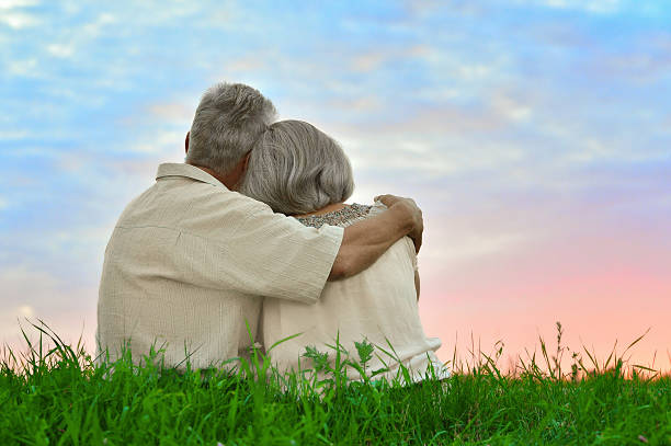 istock Senior couple resting at summer field 505935770
