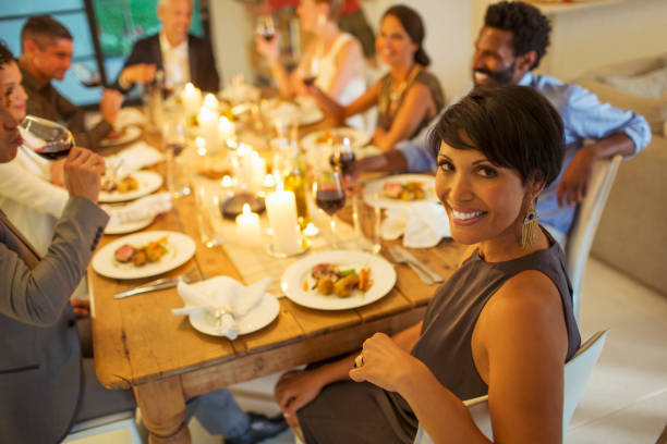 istock Woman smiling at dinner party 505935919