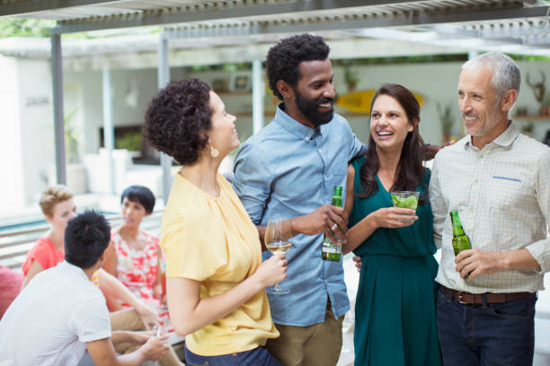 istock Friends talking at party 505935969