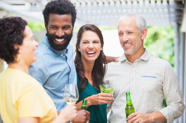 istock Friends laughing at party 505936139