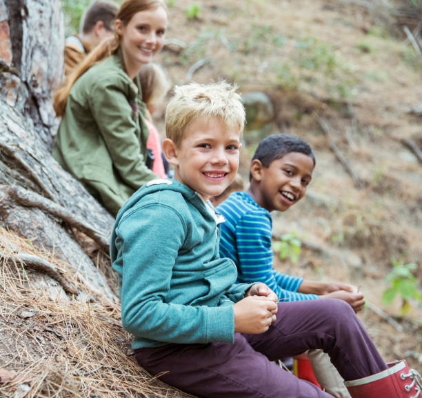 istock Students and teachers smiling in forest 505936233