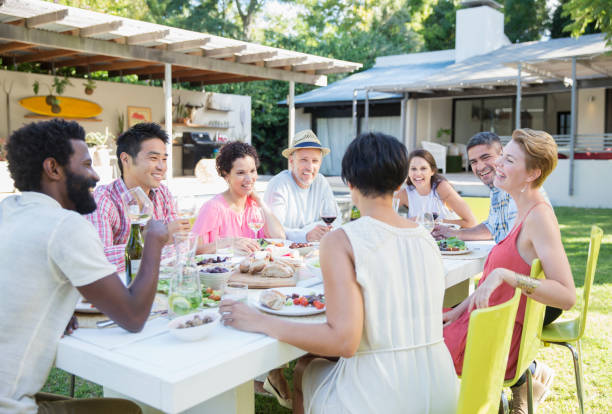 istock Friends talking at dinner party 505936287