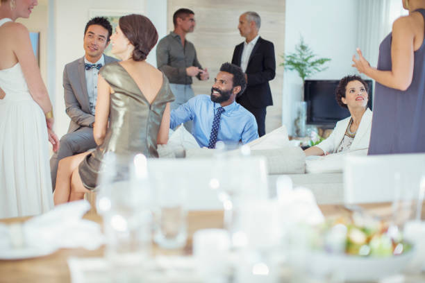 istock Friends talking at party 505936301