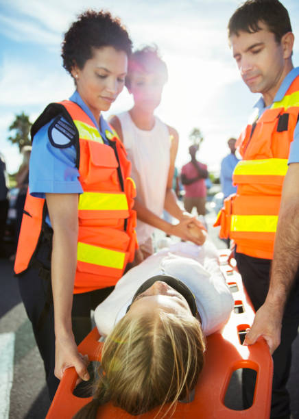 Paramedics doing CPR in an accident victim