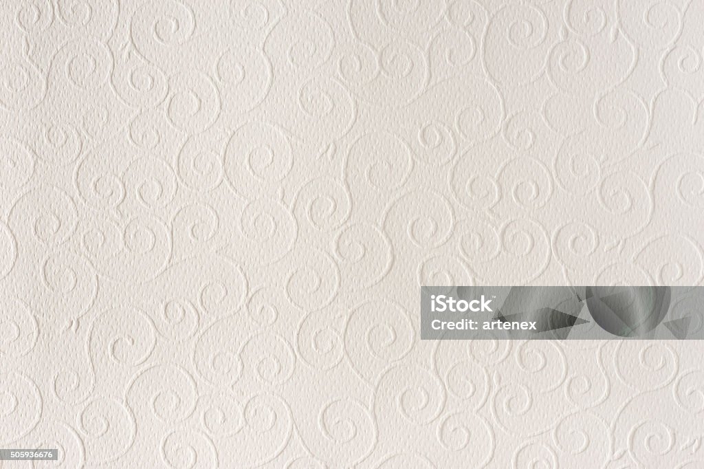 Beige paper texture background. Shells, waves, circles, shapes embossed pattern. Old white, beige paper sheet texture background. Shells, waves, circles, shapes embossed pattern. Strong light, shadows. Brocade Stock Photo