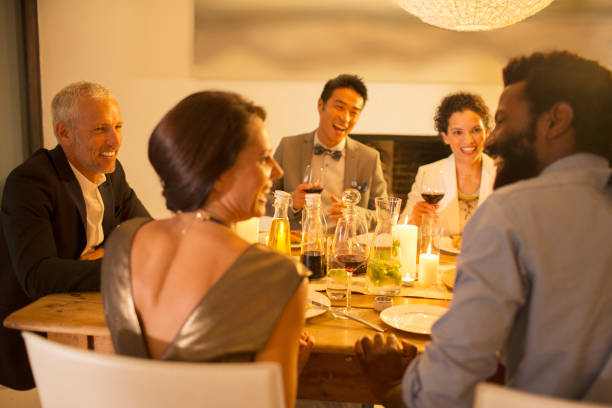 istock Friends talking at dinner party 505936693