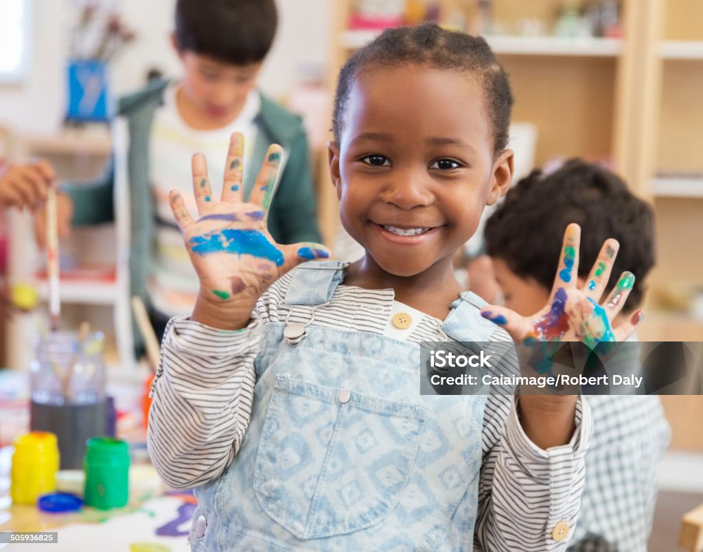 Student with messy hands in classroom  Preschool Stock Photo