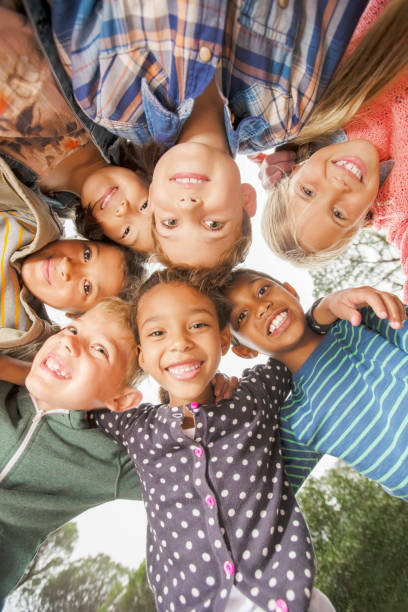 istock Children huddled together outdoors 505936871