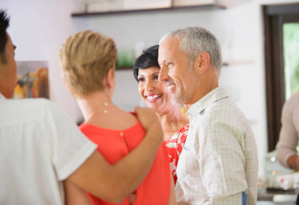 istock Friends talking at party 505937105