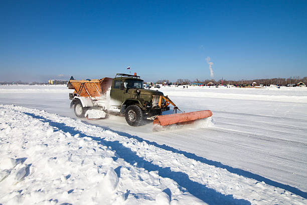 Khabarovsk, Russia - January 17, 2016: Old snowplow is cleaning track for the ice race. The pickure was taken on a frozen lake near Khabarovsk, Russia. The truck is preparing track for auto ice racing 