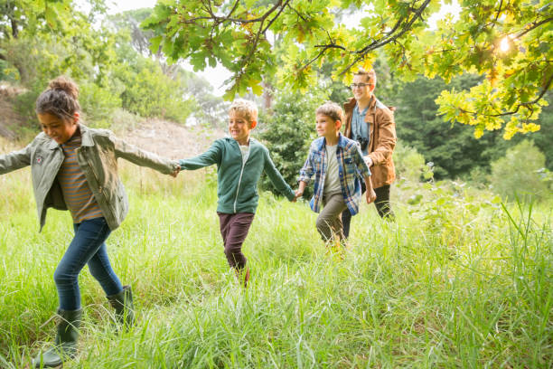 istock Students and teacher walking outdoors 505937153
