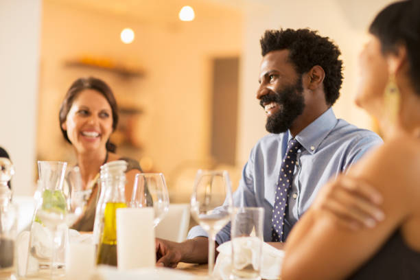 istock Friends laughing at dinner party 505937167