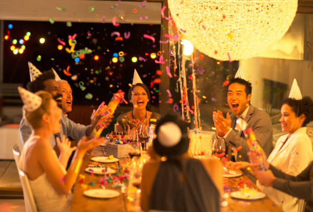 istock Friends throwing confetti at birthday party 505937321