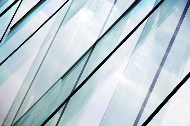 Glass architecture. Double-exposure tilt photo of contemporary office building facade. Glass architecture. Tilt double exposure photo of modern office building facade. Sample of dynamic business cityscape. Abstract high-technology composition with all-over glazing. parallel photos stock pictures, royalty-free photos & images