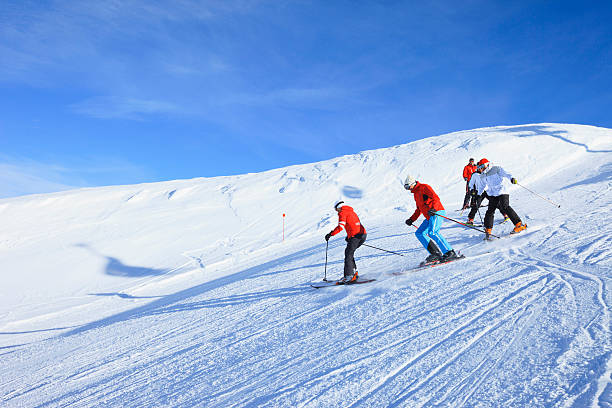 Happy skiing group  Ski school  Beautiful mountain landscape background Ski School. Group of people, skier. Snow skiing. Beautiful mountain landscape in background. ski instructor stock pictures, royalty-free photos & images