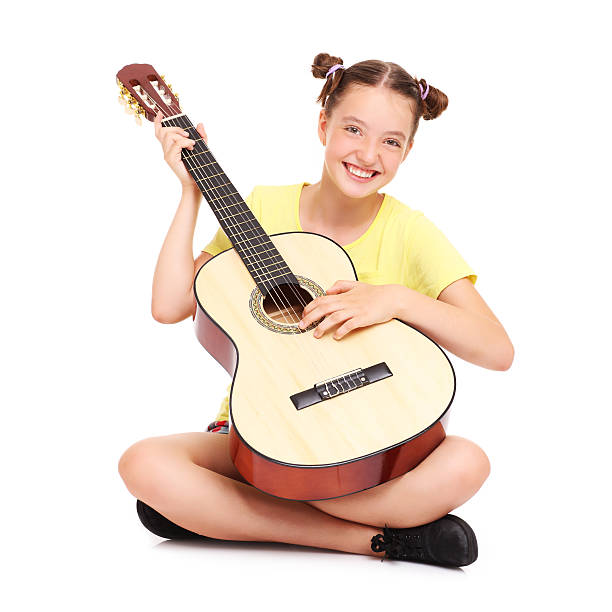 istock Happy girl and guitar 505940040