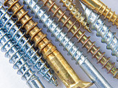 Threads of pristine brass and alloy metal screws