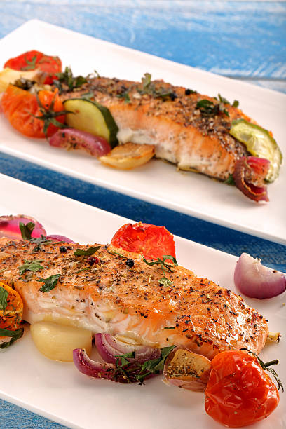 istock Baked salmon with herbs and vegetables 505943314