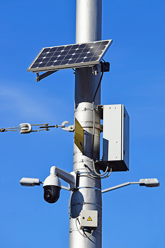 Security camera on the street powered by solar energy