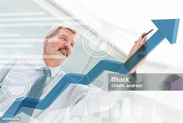 Business Man Drawing A Growth Graph Stock Photo - Download Image Now - Growth, Business, Moving Up