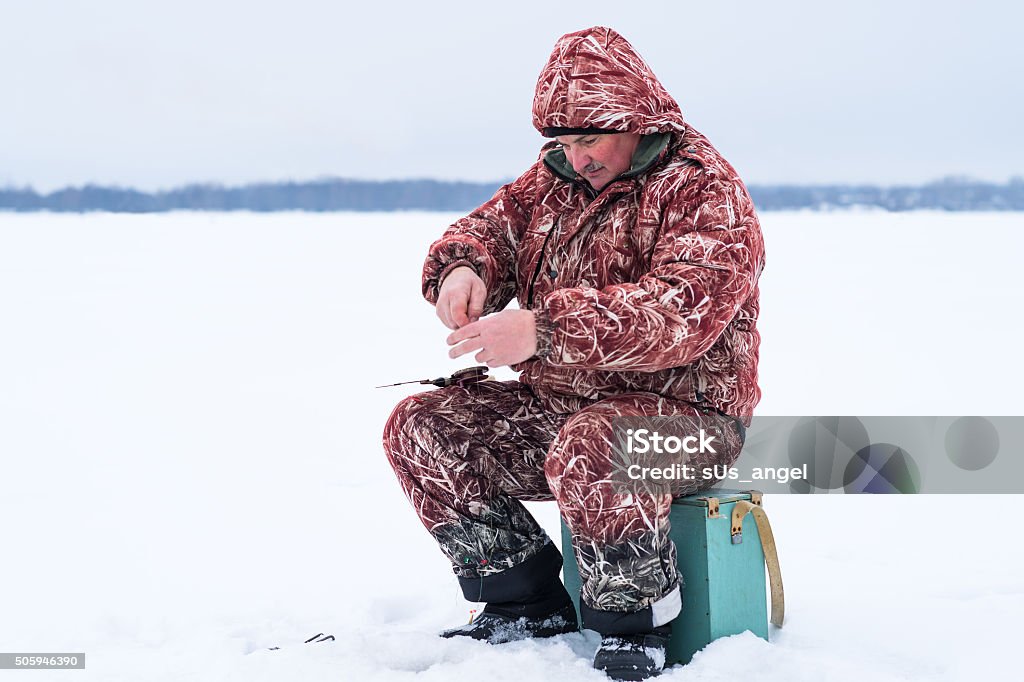 fisher preparing for fishing fisher preparing for fishing outdoors Adult Stock Photo