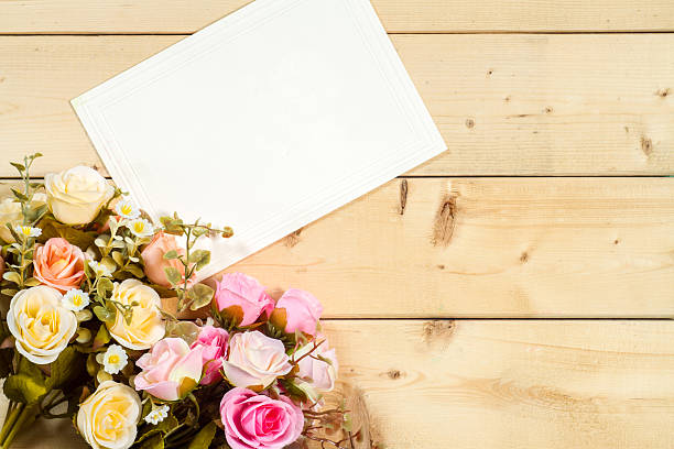 istock Roses flowers and empty tag for your text on wooden 505947554