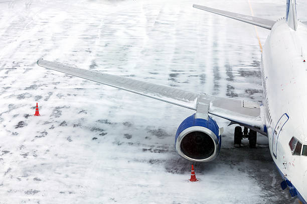 istock Passenger Airplane on airfield winter 505947688