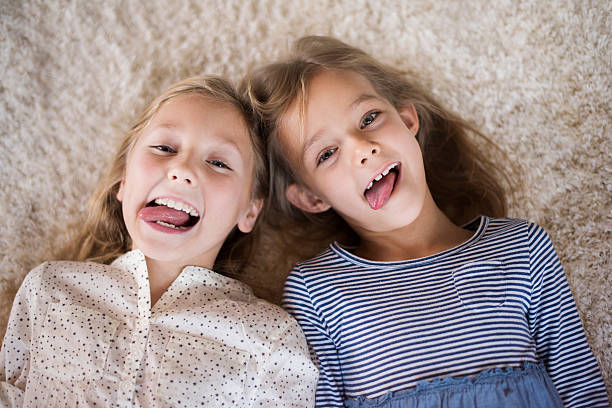 istock Cute girls making funny faces 505947718
