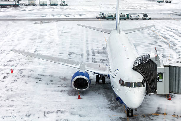 istock Passenger Airplane on airfield winter 505947798