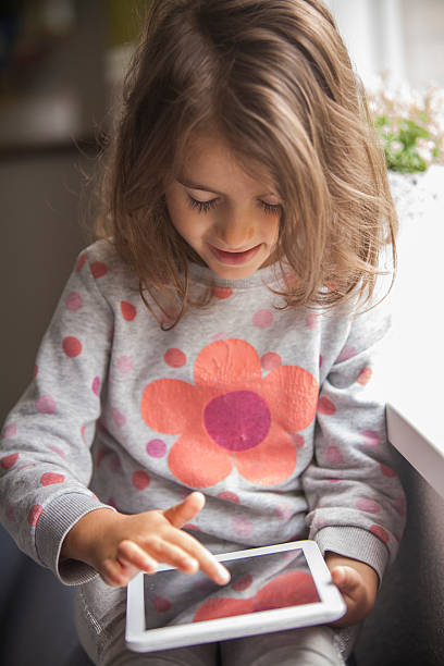 istock girl with digital tablet 505948616