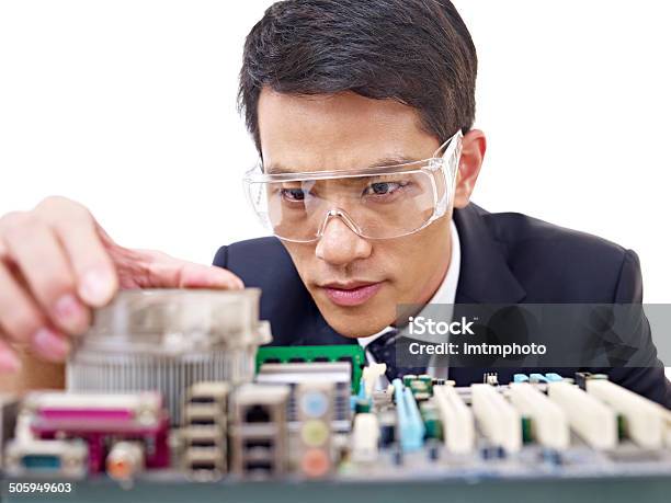 Man Fixing Computer Stock Photo - Download Image Now - IT Support, Japanese Ethnicity, Adult