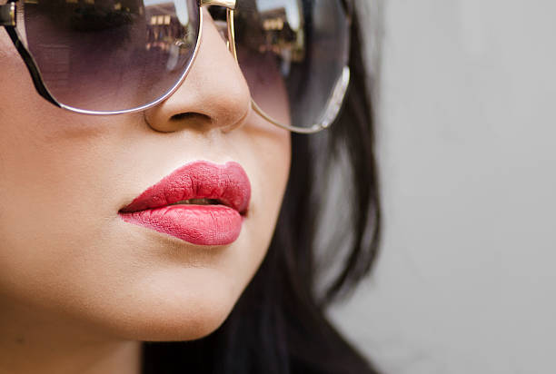 istock Woman's lips face and sunglasses 505949667