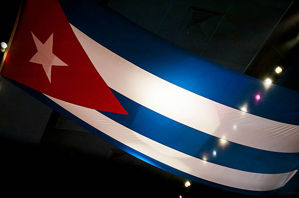 istock Oversized Cuban flag backlit  by theatrical lights 505949973
