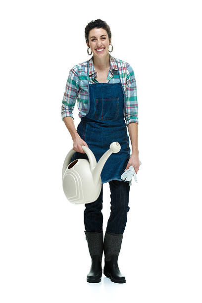 istock Smiling farmer holding watering can 505950739