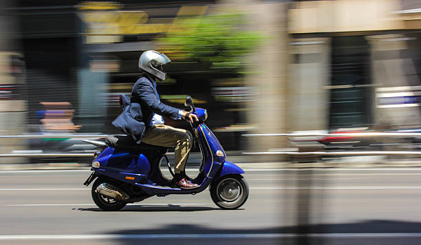istock Scooter running down the street 505951521