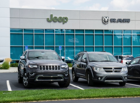 Rochester Hills, Michigan, USA - August 7, 2014: A Chrysler dealership in Rochester Hills also featuring Dodge Ram and Jeep vehicles. Chrysler is one of the largest manufacturers of trucks and cars in the world.