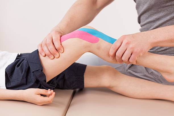 istock Small boy with kinesio tape 505960246
