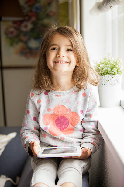 istock girl with digital tablet 505960262
