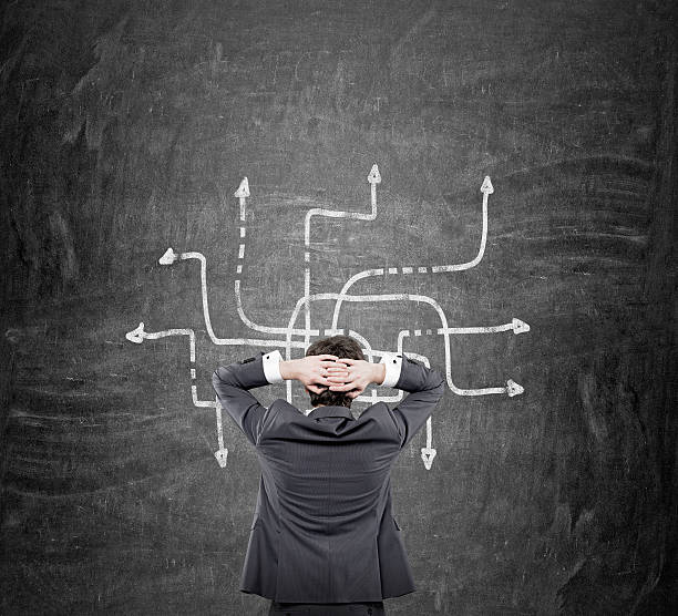 istock Businessman looking at a labyrinth 505960874