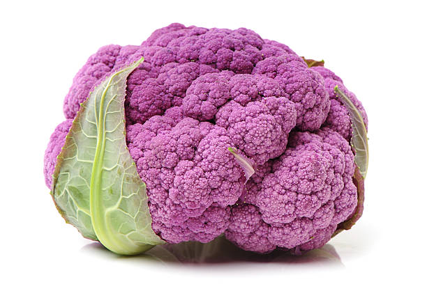 istock Isolated fresh lila cauliflower with green leaves 505961098